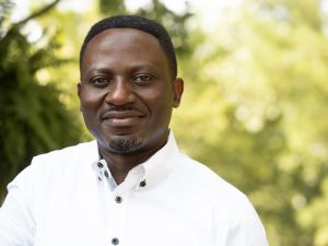 A close up portrait of Eric Mvukiyehe