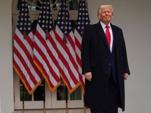 President Donald Trump stands outside the White House, April 2, 2025. Courtesy of Evan Vucci, The AP.
