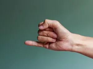 A stock image of a hand and pinky finger